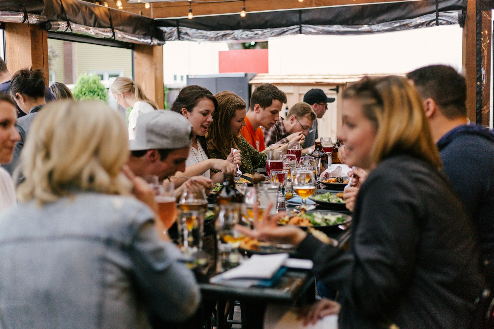 A diverse group of people sharing a meal together